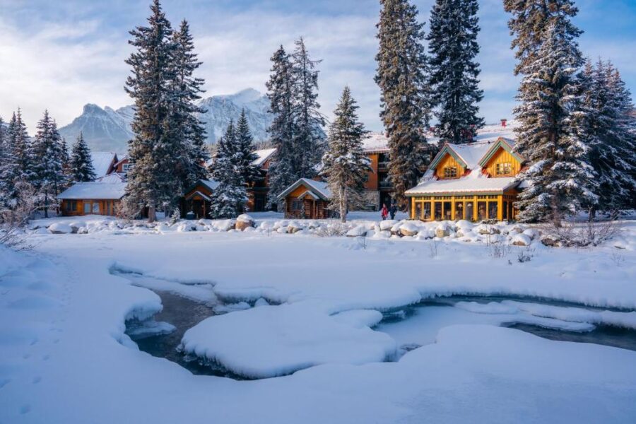 Snowy mountain view featuring Post Hotel & Spa, surrounded by tall trees and a serene winter landscape.
