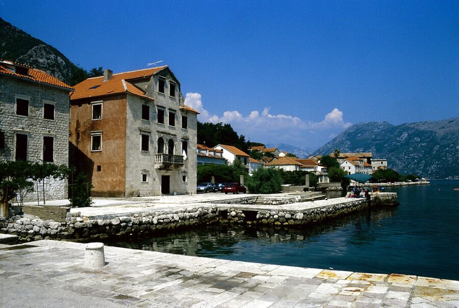 Bright blue sky above Prčanj, Kotor, showcasing a tranquil and sunny day.