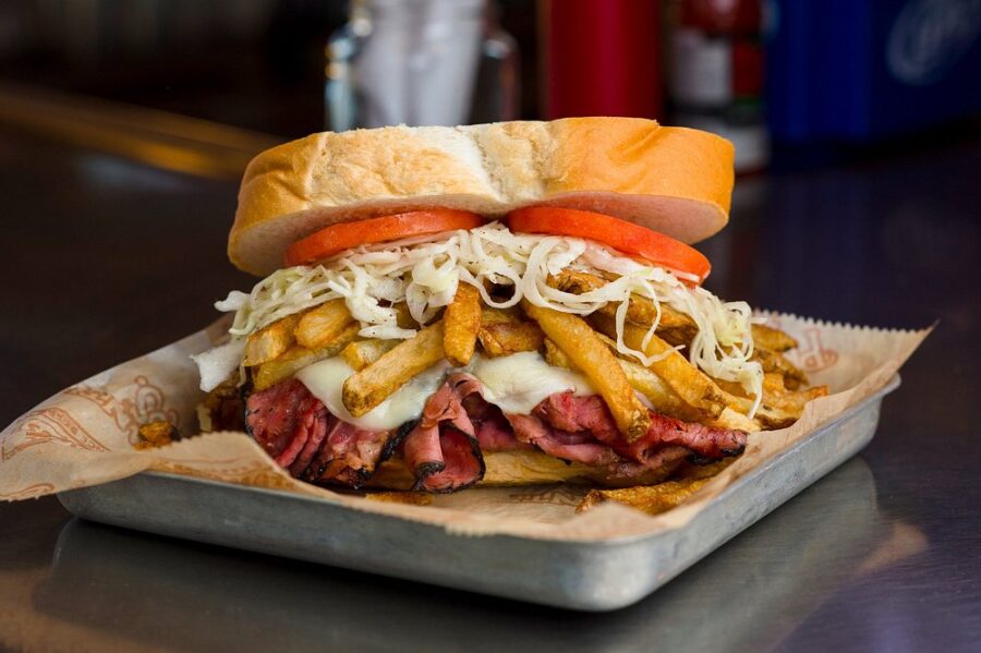  Close-up of the Primanti Brothers sandwich in Pittsburgh, featuring fresh ingredients and rich flavor. 