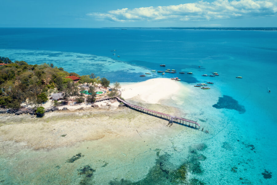 Aerial view of Prison Island in Zanzibar, showcasing lush greenery and turquoise waters surrounding the island