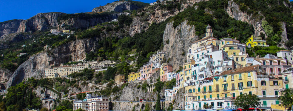 Scenic view of Atrani, a picturesque village on the Amalfi Coast, Italy, showcasing colorful buildings and coastal cliffs.