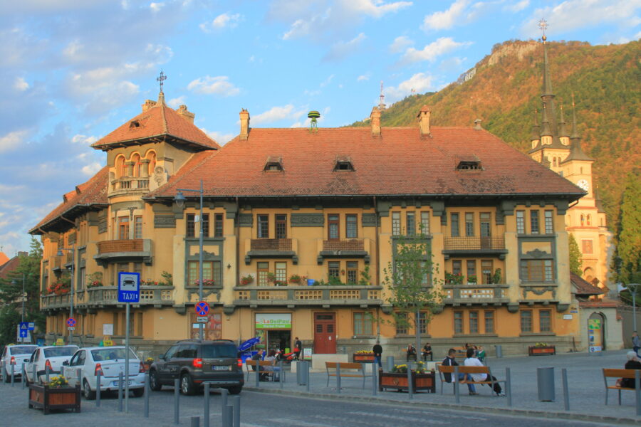 Large building with a red roof located in Prund-Schei, Brașov, Romania.