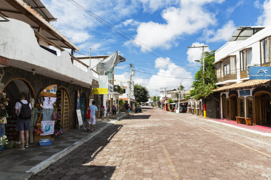 Shopping street in Puerto Ayora, Santa Cruz, Galapagos Islands, vibrant shops and tropical ambiance.