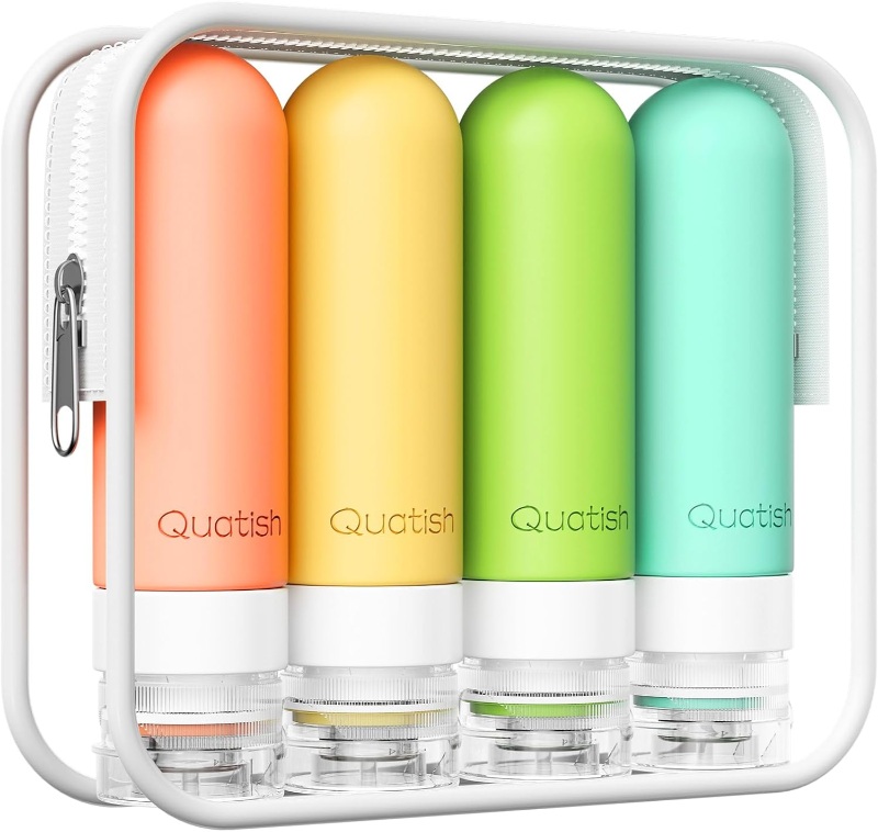 Four colorful Quatish silicone travel bottles displayed in a white case, ideal for travel and organization