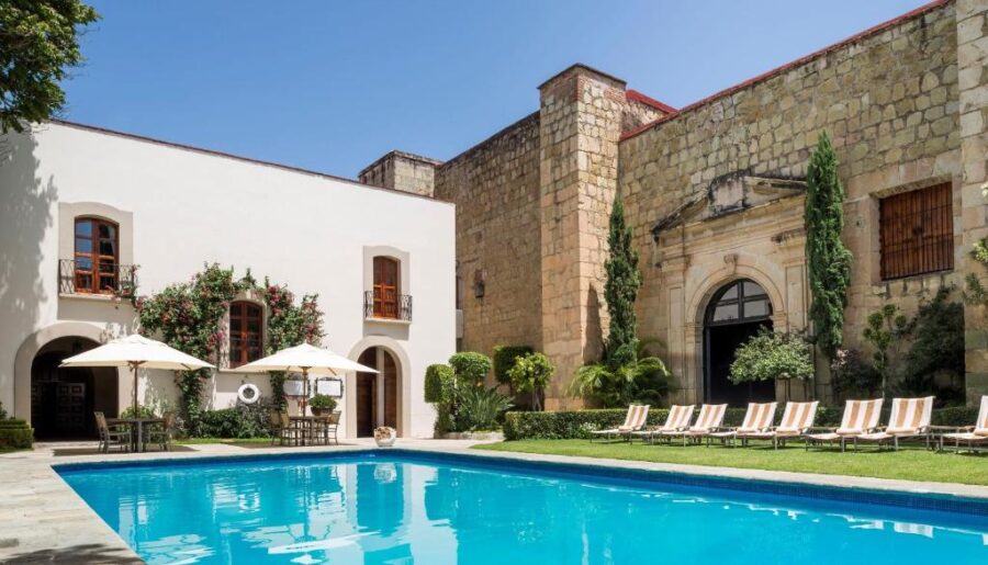 The tranquil pool area in the courtyard of Quinta Real Oaxaca, featuring inviting water and beautiful landscaping.