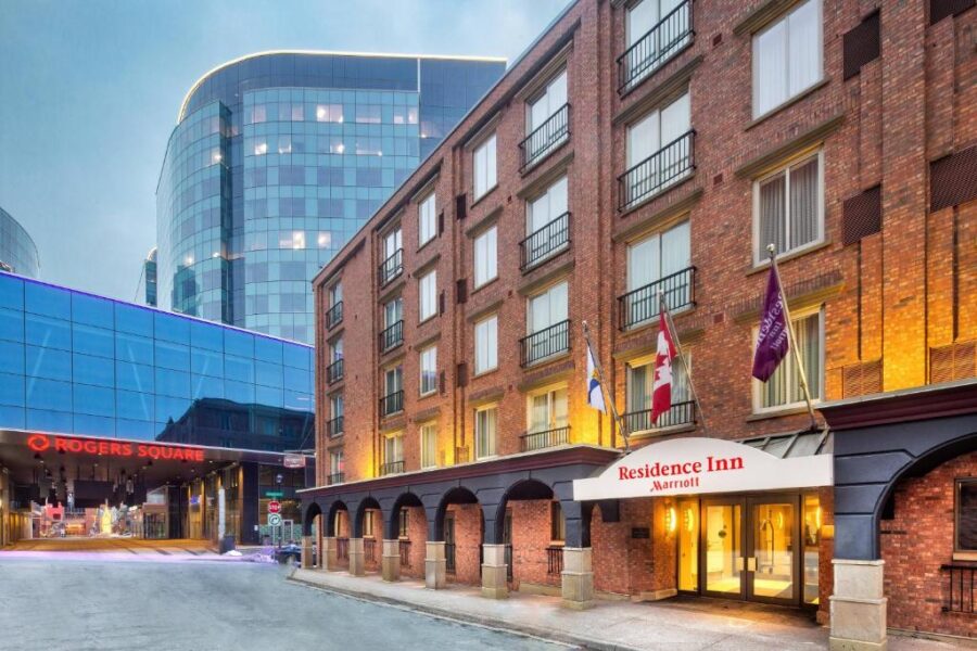 Front entrance of the Hilton Hotel in Toronto, featuring modern architecture and welcoming signage.