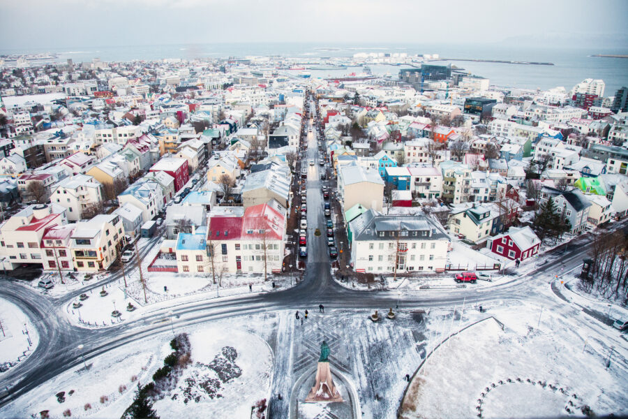 Panoramic view of Reykjavik from the Clock Tower of Hallgrímskirkja, showcasing the city's skyline and surrounding landscape