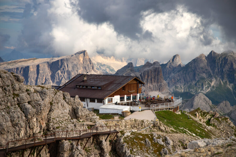 Scenic view of Rifugio Lagazuoi, a mountain hut in the Dolomites, Italy, set against dramatic mountain landscapes