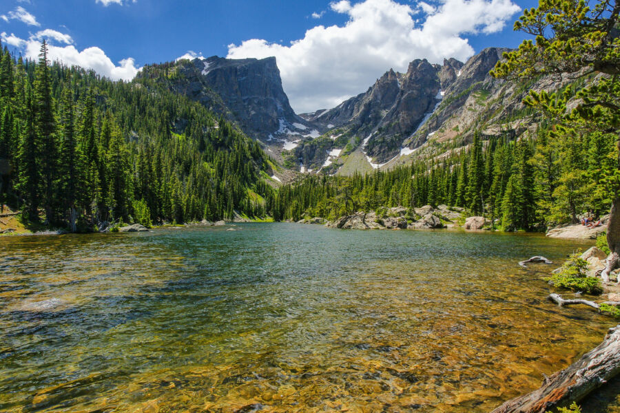 Scenic view of Dream Lake in Rocky Mountain National Park, Colorado, with clear waters and towering mountains