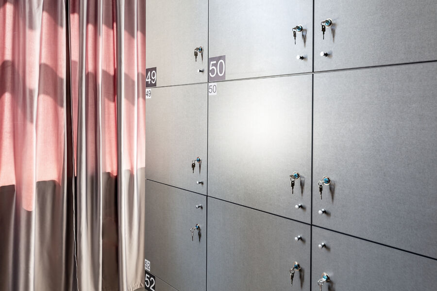 Modern hostel lockers lined up, featuring unique numbers for convenient access and personal storage solutions
