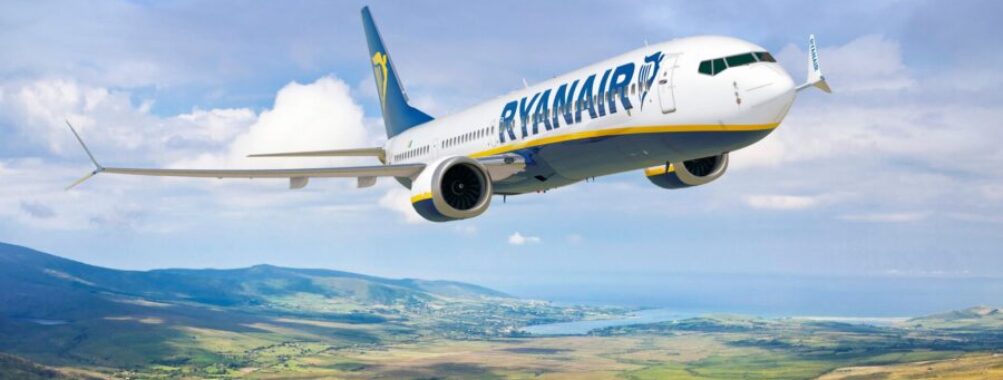 Ryanair BoeinsHow to Get Refund on Canceled Ryanair Flight: 5 Insider Steps for Fast Compensationg 737 flying over scenic European landscape with hills and ocean.