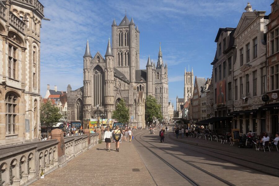 Saint Bavo Cathedral in Ghent, showcasing its impressive tall tower and intricate architectural details.
