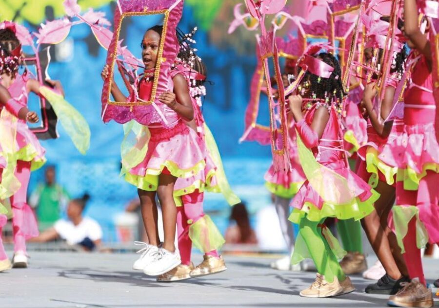 Colorful parade with dancers celebrating at Saint Lucia Carnival, showcasing vibrant costumes and lively music