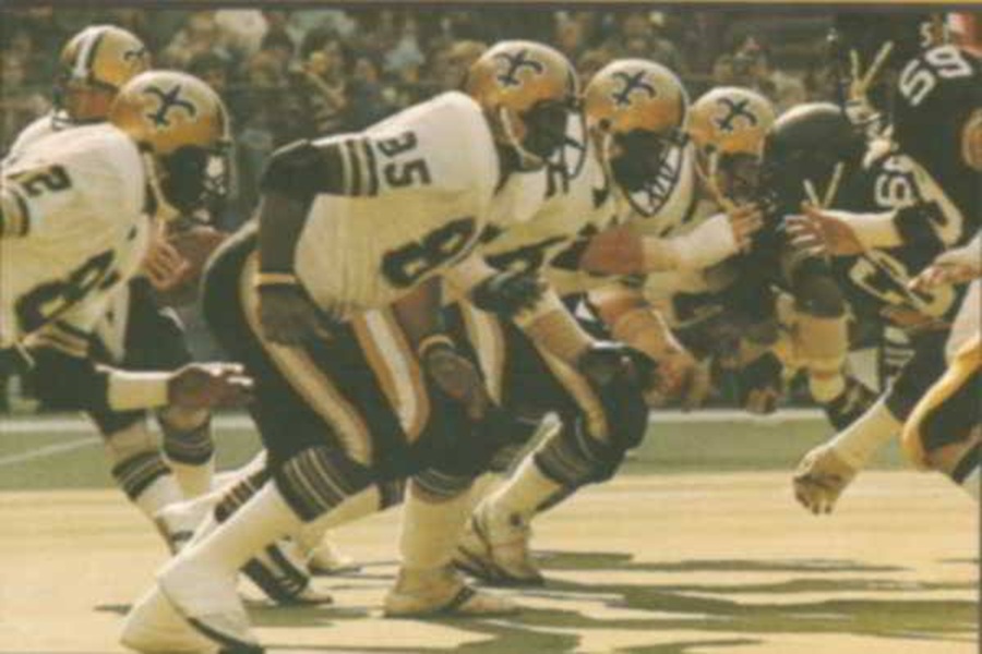 New Orleans Saints football action against Pittsburgh Steelers in dynamic stadium setting.