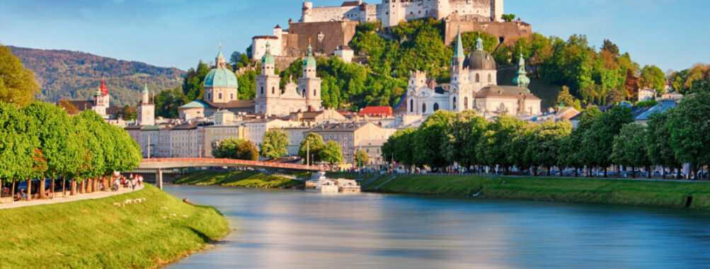 Panoramic view of Salzburg, Austria, showcasing its historic architecture and surrounding mountains.