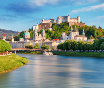 Panoramic view of Salzburg, Austria, showcasing its historic architecture and surrounding mountains.
