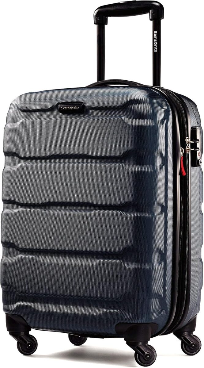 Black Samsonite Omni PC hardside carry-on suitcase with wheels, featuring an expandable design for extra packing space.
