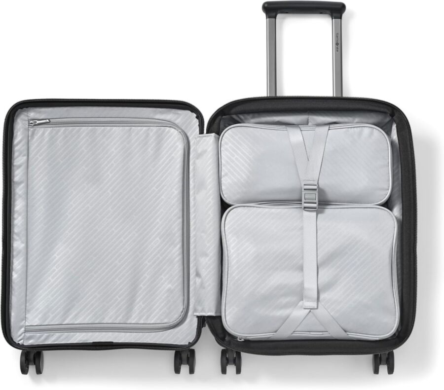 Black and white Samsonite Paralux suitcase featuring four organized compartments for efficient packing.