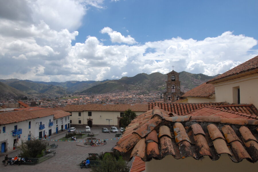 Serene view of a cloudy blue sky above San Blas in Cusco, Peru, enhancing the landscape's beauty.