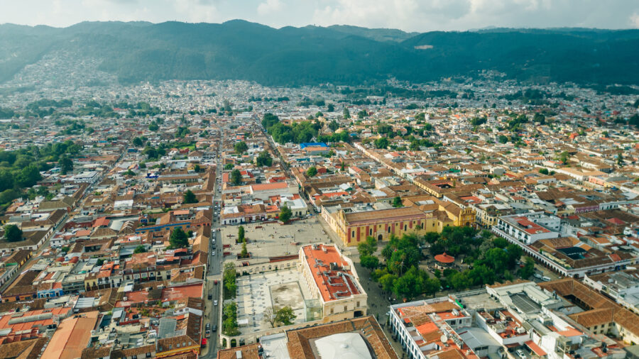 Aerial view of Central Square in San Cristobal de Las Casas, Mexico, showcasing a sunny morning with vibrant surroundings