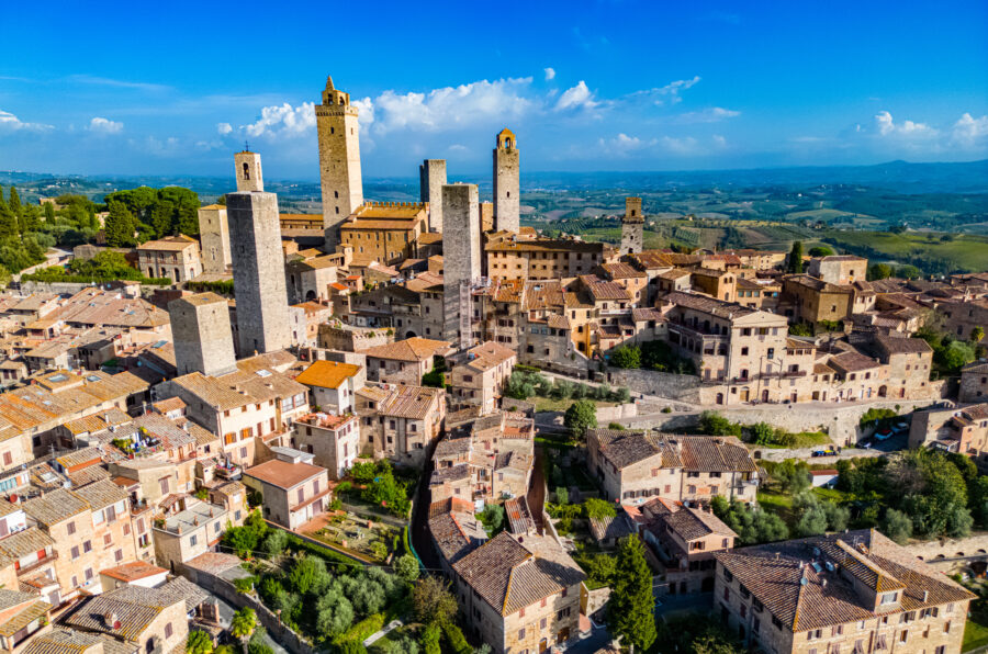 Aerial view of San Gimignano, showcasing its medieval towers and surrounding Tuscan landscape