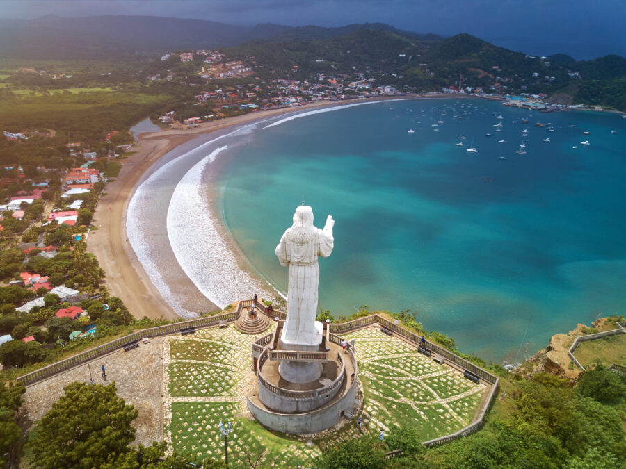 Scenic cityscape of San Juan del Sur, Nicaragua, featuring colorful buildings and the beautiful coastline