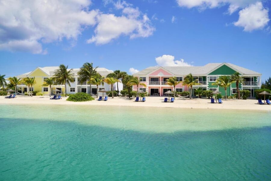 Sandyport Beach Resort in Nassau, Bahamas, featuring a picturesque beach with soft sand and clear blue waters.