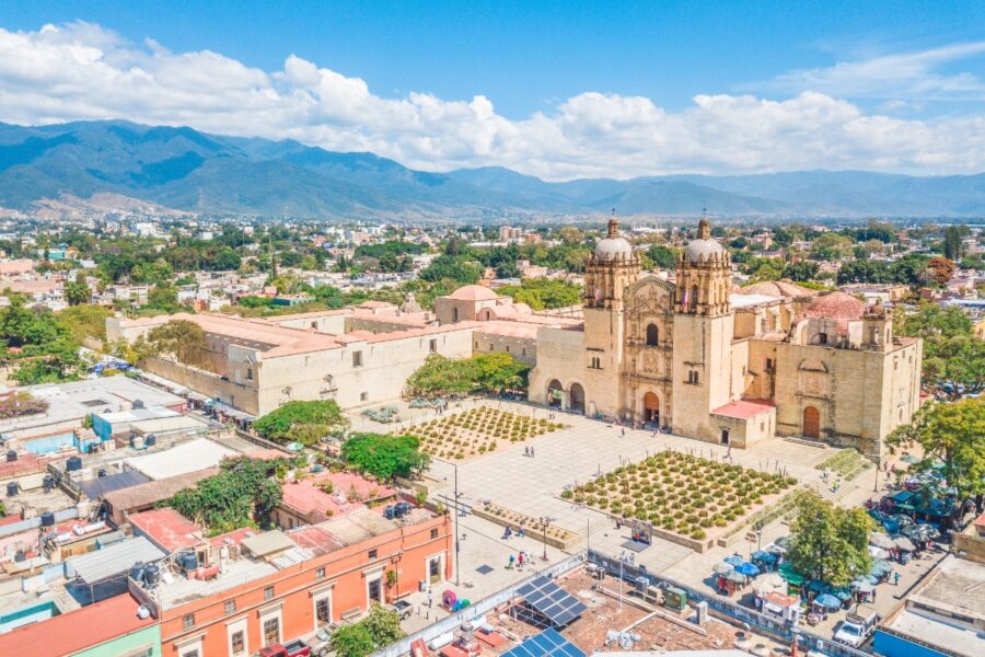 Aerial view of the historic Santo Domingo Old Monastery surrounded by lush greenery in Oaxaca, Mexico
