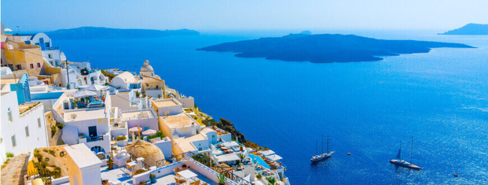 Santorinis whitewashed buildings, Aegean Sea views, volcanic island; Mediterranean paradise.