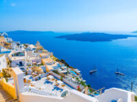 Santorinis whitewashed buildings, Aegean Sea views, volcanic island; Mediterranean paradise.