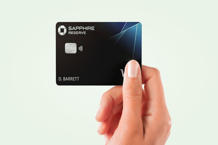 Luxurious Sapphire Reserve credit card in hand showcasing elegance, technology, and premium benefits.