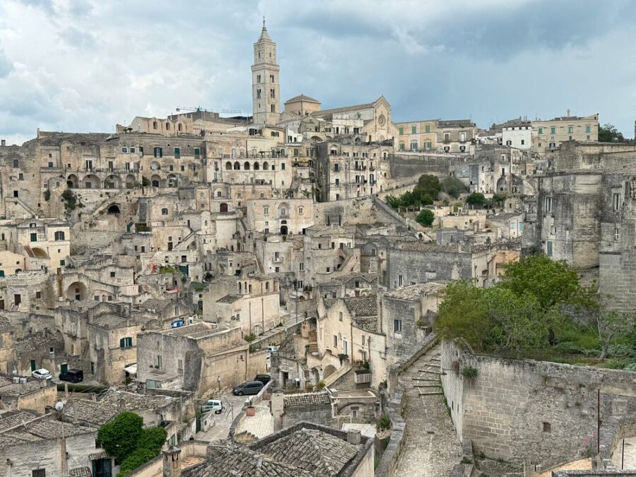 Scenic view of Sasso Barisano, a historic district in Matera, Italy, showcasing ancient stone buildings and winding streets.