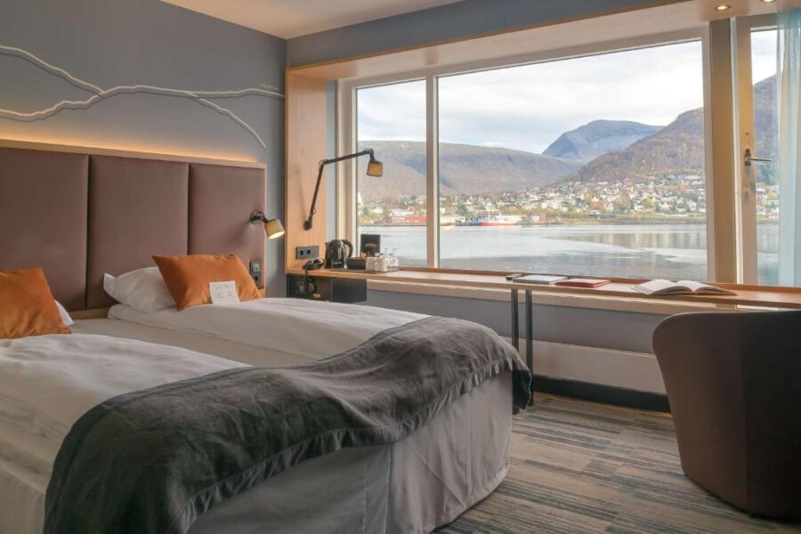 Hotel room with two beds and a mountain view at Scandic Ishavshotel in Tromsø.
