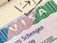 Detailed view of a Schengen visa in a passport, highlighting the unique design elements of a visa stamp