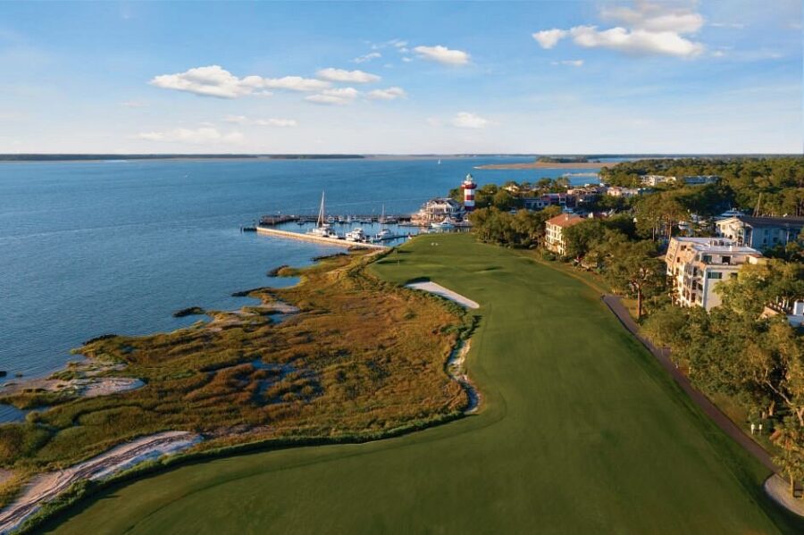 Aerial view of the Harbor Club golf course in Charleston, SC, showcasing its manicured fairways and surrounding water.
