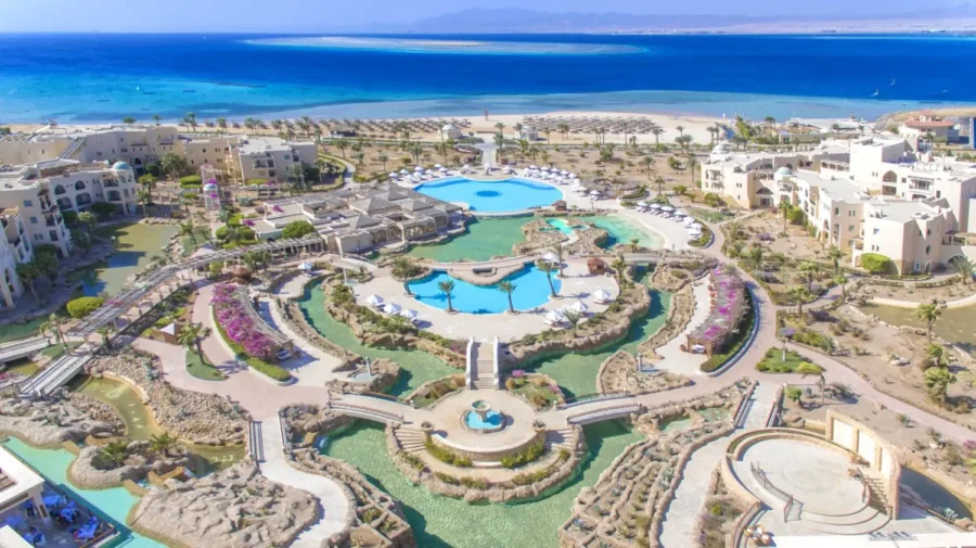 Luxury Red Sea beachfront resort in Soma Bay with lagoon pools, private beach, and palm trees.
