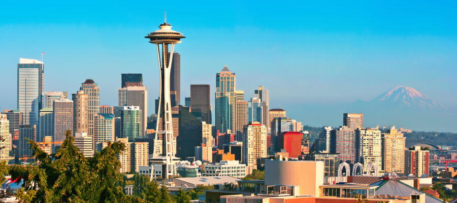 Stunning Seattle skyline at sunset, viewed from Kerry Park, showcasing vibrant colors and iconic Space Needle