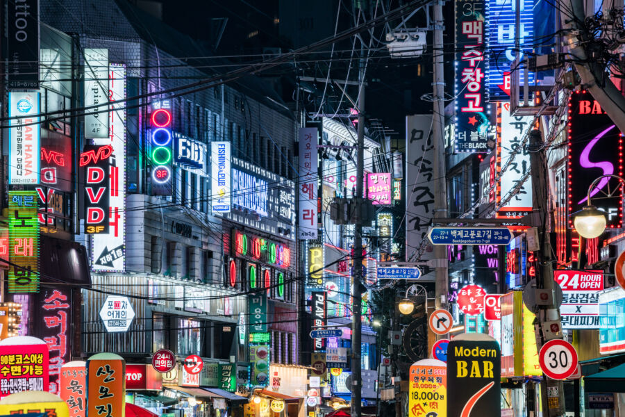 Colorful neon advertisements light up the bustling nightlife scene in Songpa Gu, Seoul, South Korea