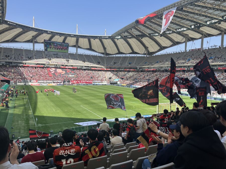Players compete in a thrilling match during the Seoul World Cup football game