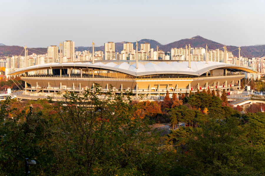 Exterior view of Seoul World Cup Stadium in Mapo, South Korea, featuring its distinctive design and surrounding landscape