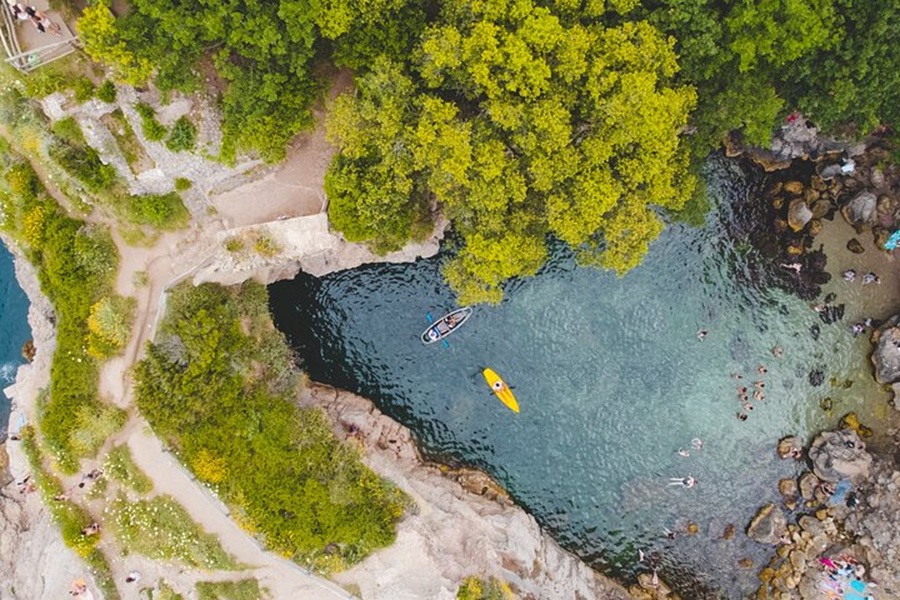 Aerial view of kayaking and nature at Marina Grande Beach.