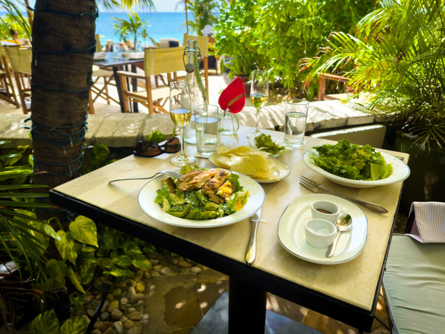 Close-up of lunch served on a balcony overlooking Seven Mile Beach in the Caribbean, Grand Cayman
