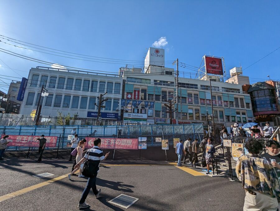 Bustling view of Shimokitazawa, Japan, featuring eclectic shops, cafes, and people exploring the vibrant urban landscape.