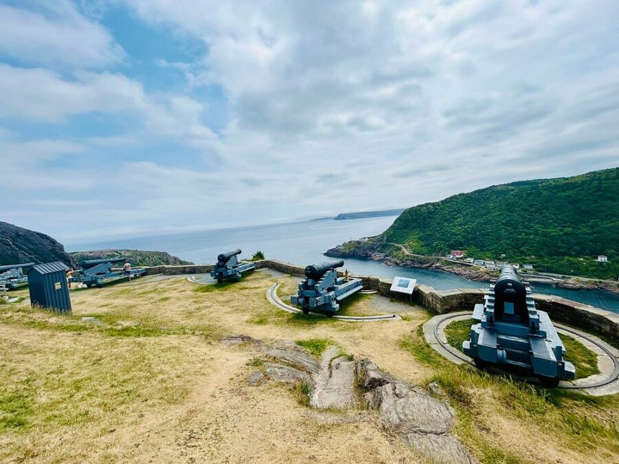Panoramic view of military vehicles on Signal Hill, overlooking the ocean in St. John's, Canada.