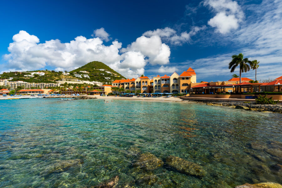 Little Bay Beach in Sint Maarten features crystal clear waters, inviting soft sand, and a tranquil tropical setting.