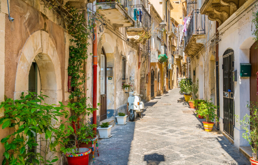 Picturesque street in Ortigia, Siracusa, highlighting the unique architecture and vibrant ambiance of Sicily's old town