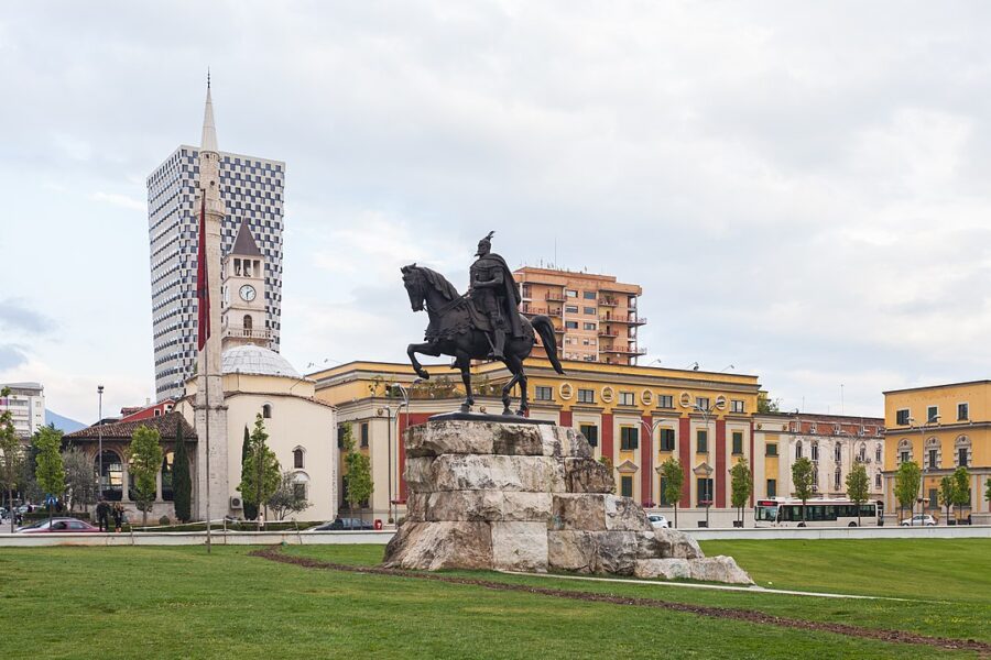 In Skanderbeg Square, Tirana, a statue depicts a man on a horse, symbolizing historical significance in the park.