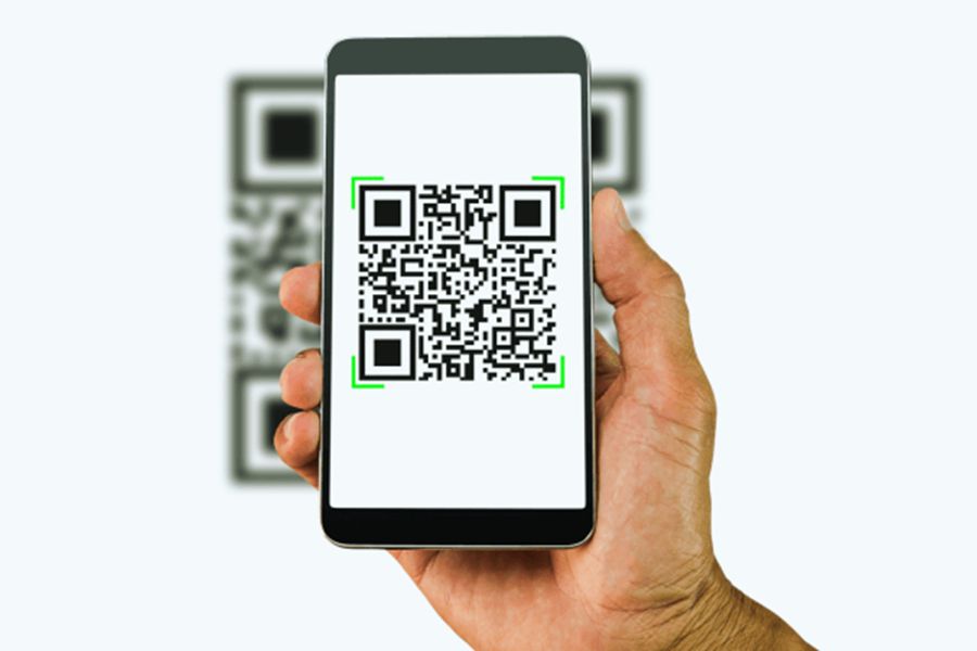 Smartphone displaying QR code for eSIM installation, emphasizing digital connectivity and modern technology.