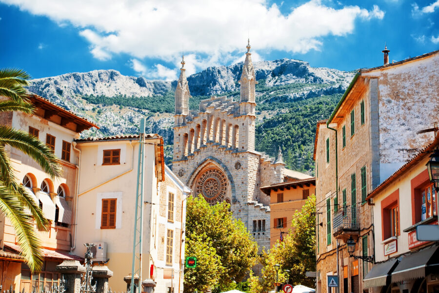 Scenic view of Soller, Majorca, showcasing its charming architecture and lush mountainous backdrop.