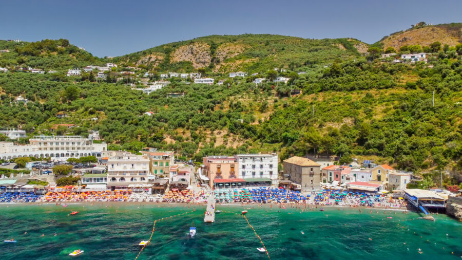 Aerial view of Marina del Cantone Beach, showcasing its turquoise waters and surrounding cliffs along the Amalfi Coast, Italy